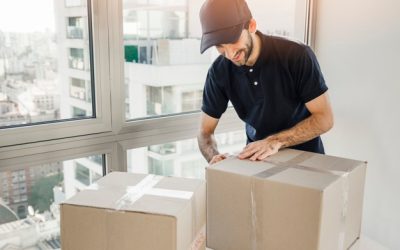 delivery-man-preparing-parcel-shipment-clients_23-2147862246