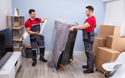 professional-movers-doing-home-relocation-two-young-male-wrapping-sofa-plastic-wrap-living-room-210624645